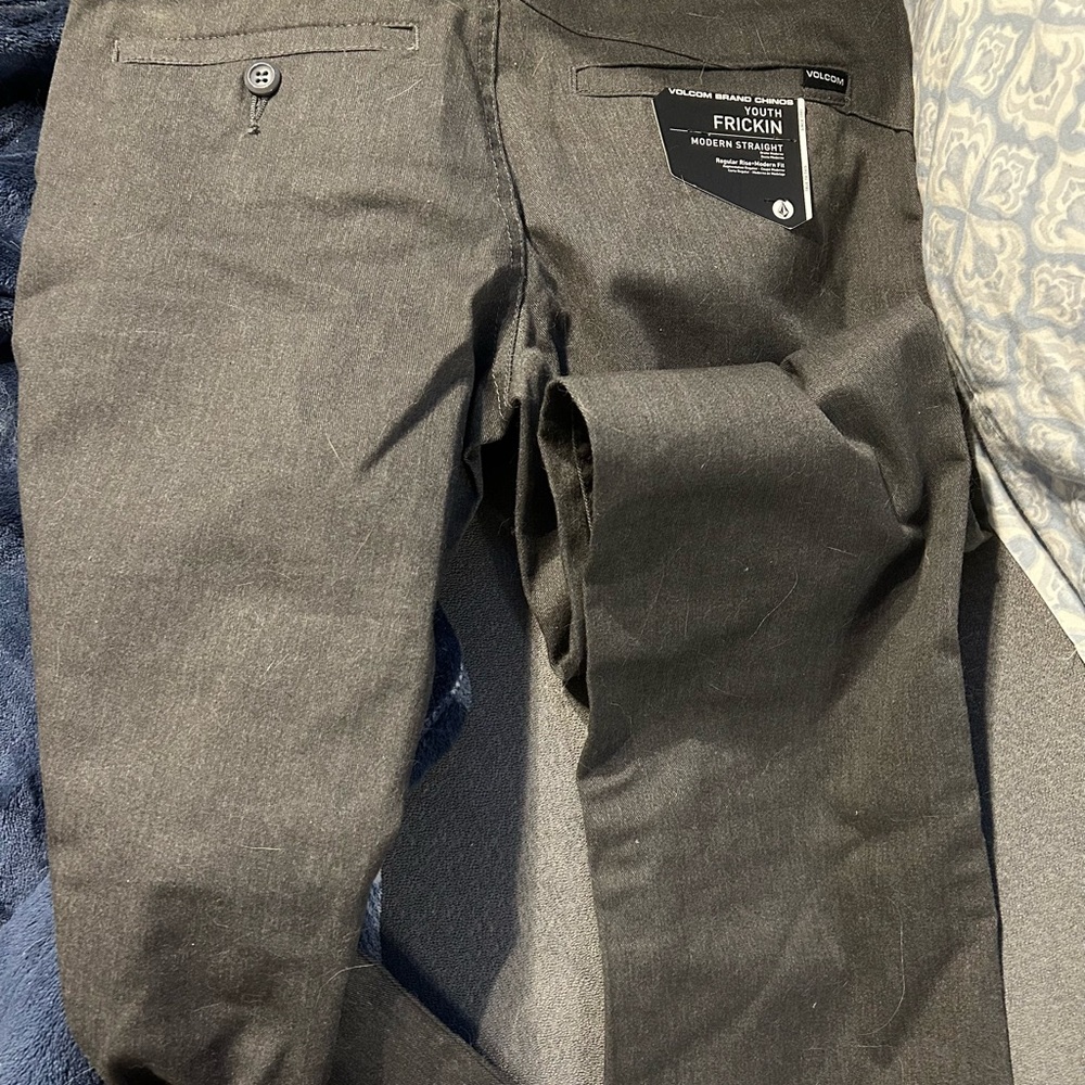 Boys grey Volcom pants. NWT. Size 26; Would typically fit a 12-14 yr old.